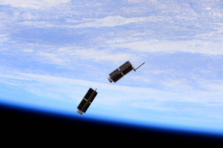 Illustration for article titled These Tiny Satellites Just Left The International Space Station